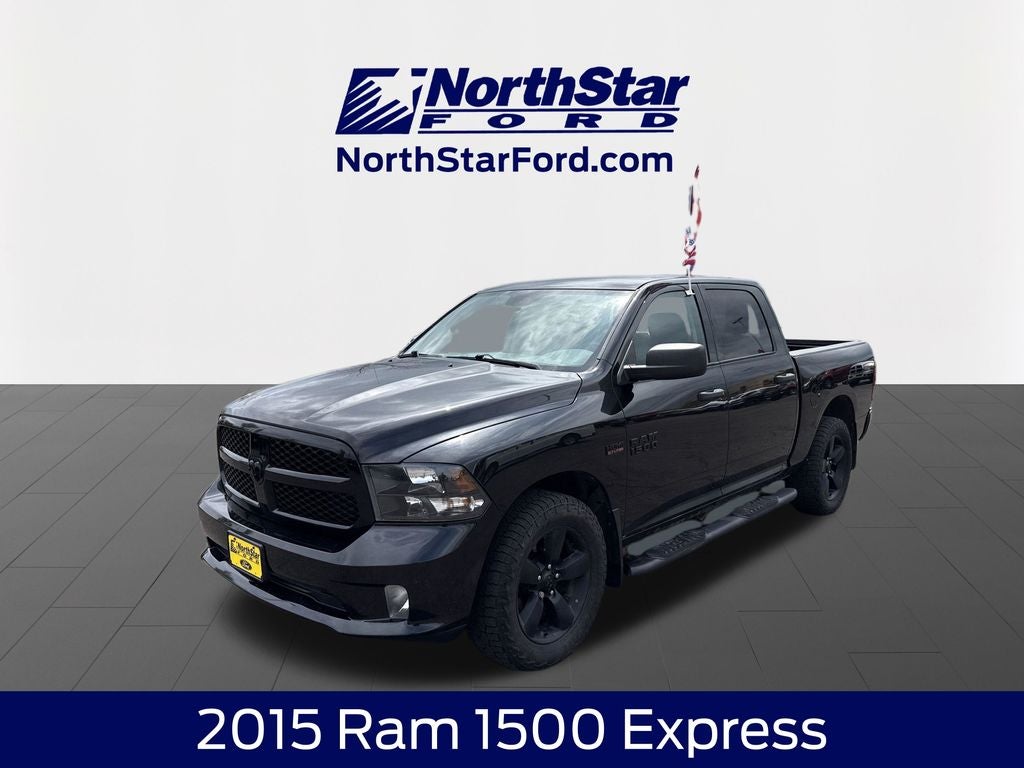 2015 RAM 1500 Express in Brilliant Black Crystal Pearlcoat — front three-quarter view