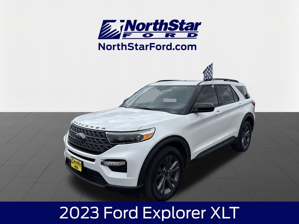 2023 Ford Explorer XLT in Star White Metallic Tri-Coat — front three-quarter view